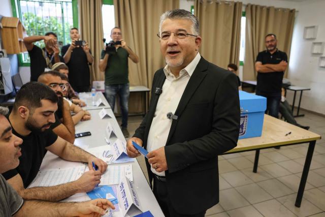 Yousef Jabareen, leader of Israel's Arab-led Joint List political alliance, reacts after casting his ballot to vote at a polling station in the Arab-Israeli town of Umm al-Fahm on October 27, 2026, on the day of Israel's legislative election. Israelis began voting on October 27 in the first general election since Hamas's October 7, 2023 attack, with voters to deliver their verdict on Prime Minister Benjamin Netanyahu and the country's rightward drift. (Photo by AHMAD GHARABLI / AFP)
