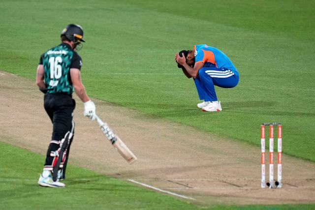 India's Arshdeep Singh (R) reacts to a missed run out on New Zealand Finn Allen (L) during the 3rd T20i cricket match between New Zealand and India at the Hnry Stadium in Wellington on October 27, 2026. (Photo by Marty MELVILLE / AFP)