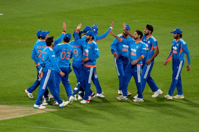 Indian players celebrate New Zealand Tim Seifert being caught during the 3rd T20i cricket match between New Zealand and India at the HNRY Stadium in Wellington on October 27, 2026. (Photo by Marty MELVILLE / AFP)