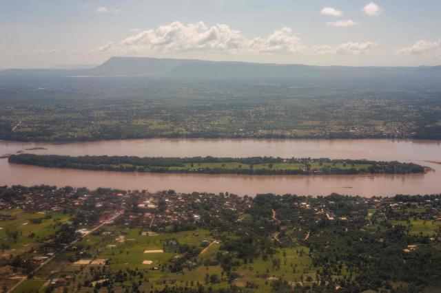 This aerial picture taken from a plane on October 19, 2026, shows an island on the Mekong River in Laos’ southern Champasak province, shortly before landing at Pakse airport. (Photo by ANTHONY WALLACE / AFP)