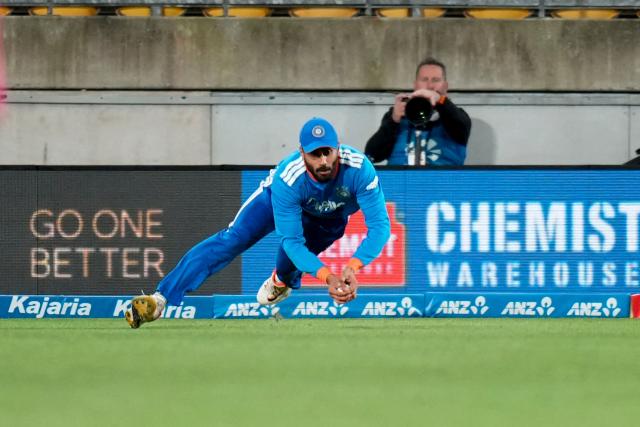 India's Naman Dhir catches New Zealand Finn Allen during the 3rd T20 cricket match between New Zealand and India at the HNRY Stadium in Wellington on October 27, 2026. (Photo by Marty MELVILLE / AFP)