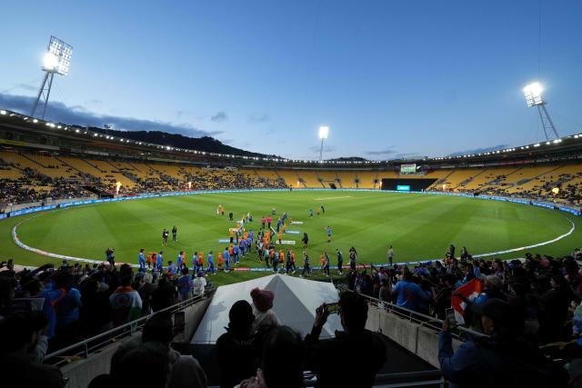 New Zealand (R) and India's teams walk onto the field for national anthems during the 3rd T20 cricket match between New Zealand and India at the HNRY Stadium in Wellington on October 27, 2026. (Photo by Marty MELVILLE / AFP)