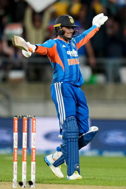 India's Abhishek Sharma celebrates after reaching his century (100 runs) during the 3rd T20i cricket match between New Zealand and India at the Hnry Stadium in Wellington on October 27, 2026. (Photo by Marty MELVILLE / AFP)