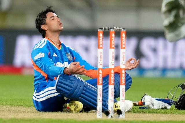 India's Abhishek Sharma celebrates after reaching his century (100 runs) during the 3rd T20i cricket match between New Zealand and India at the Hnry Stadium in Wellington on October 27, 2026. (Photo by Marty MELVILLE / AFP)