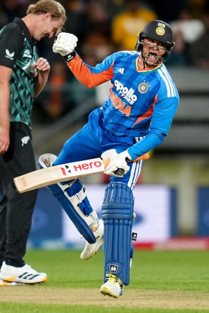 India's Abhishek Sharma celebrates 100 runs during the 3rd T20 cricket match between New Zealand and India at the HNRY Stadium in Wellington on October 27, 2026. (Photo by Marty MELVILLE / AFP)