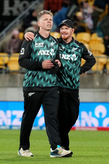 New Zealand Michael Bracewell (L) and teammate Glenn Phillips walk from the field after their loss during the 3rd T20 cricket match between New Zealand and India at the HNRY Stadium in Wellington on October 27, 2026. (Photo by Marty MELVILLE / AFP)