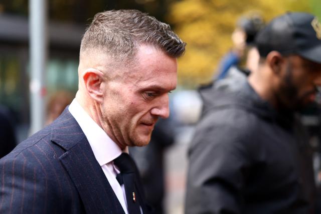 British far-right activist Tommy Robinson, real name Stephen Yaxley-Lennon, arrives at the Southwark Crown Court in London on October 27, 2026. Robinson, who is being tried under his real name, has denied charges of harassing two journalists through his X account between August 5 and 7, 2024. (Photo by Toby Shepheard / AFP)