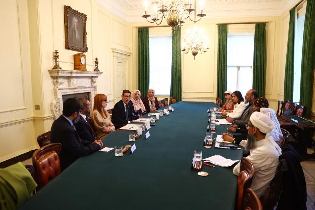 Britain's Prime Minister Andy Burnham (4L) and Britain's Housing Secretary Angela Rayner (3L), host Muslim community leaders during a roundtable inside Downing Street in London on October 27, 2026. (Photo by Peter Nicholls / POOL / AFP)
