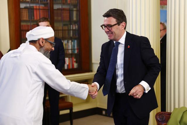 Britain's Prime Minister Andy Burnham (R) welcomes Muslim community leaders ahead of a roundtable inside Downing Street in London on October 27, 2026. (Photo by Peter Nicholls / POOL / AFP)