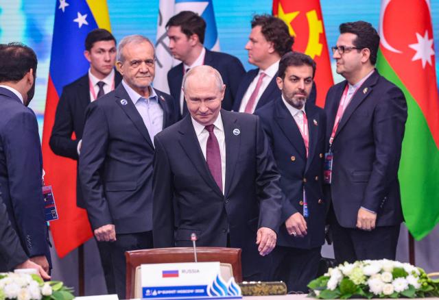 Russian President Vladimir Putin and Iranian President Masoud Pezeshkian attend the 8th Gas Exporting Countries Forum (GECF) summit at the World Trade Center in Moscow on October 27, 2026. (Photo by MAXIM SHIPENKOV / POOL / AFP)