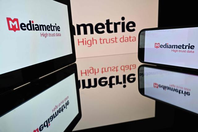 This photograph shows the logo of Mediametrie, French audience measurement company, displayed on screens in Toulouse, southwestern France on October 27, 2026. (Photo by Lionel BONAVENTURE / AFP)
