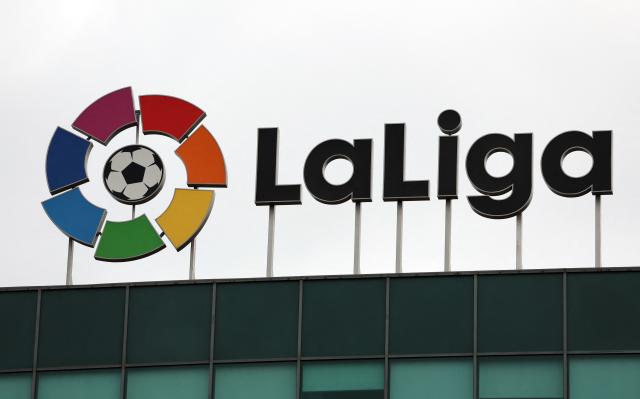 (FILES) The logo of Spain's La Liga football association stands ontop of its headquarters in Madrid on December 20, 2022. Chinese state television has suspended broadcasts of La Liga matches following remarks by Real Madrid star Kylian Mbappe about Mao Zedong, state-owned China Media Group announced on October 27, 2026. (Photo by Thomas COEX / AFP)