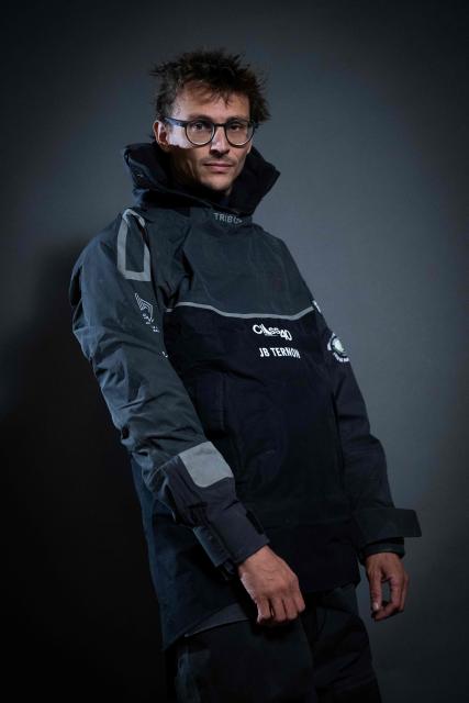 "Mic Odyssey" Class40 French sailor Jean-Baptiste Ternon poses for a photo session in Saint-Malo, western France a few days before the start of the 13th Route du Rhum - Destination Guadeloupe in Saint-Malo, western France, on October 27, 2026. From Saint-Malo in Brittany to Pointe-a-Pitre in Guadeloupe, 115 skippers across 6 classes will take the start on November 1, 2026, in this solo transatlantic sailing race. (Photo by Martin BUREAU / AFP)