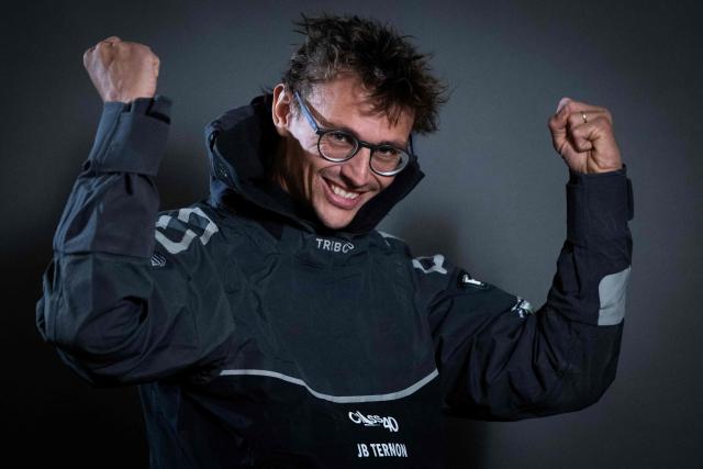 "Mic Odyssey" Class40 French sailor Jean-Baptiste Ternon poses for a photo session in Saint-Malo, western France a few days before the start of the 13th Route du Rhum - Destination Guadeloupe in Saint-Malo, western France, on October 27, 2026. From Saint-Malo in Brittany to Pointe-a-Pitre in Guadeloupe, 115 skippers across 6 classes will take the start on November 1, 2026, in this solo transatlantic sailing race. (Photo by Martin BUREAU / AFP)