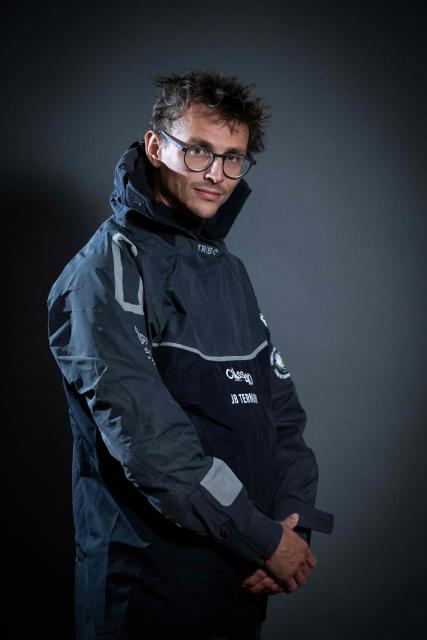 "Mic Odyssey" Class40 French sailor Jean-Baptiste Ternon poses for a photo session in Saint-Malo, western France a few days before the start of the 13th Route du Rhum - Destination Guadeloupe in Saint-Malo, western France, on October 27, 2026. From Saint-Malo in Brittany to Pointe-a-Pitre in Guadeloupe, 115 skippers across 6 classes will take the start on November 1, 2026, in this solo transatlantic sailing race. (Photo by Martin BUREAU / AFP)