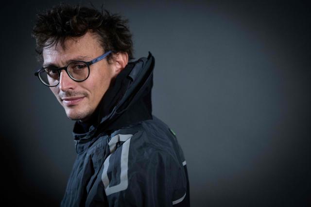 "Mic Odyssey" Class40 French sailor Jean-Baptiste Ternon poses for a photo session in Saint-Malo, western France a few days before the start of the 13th Route du Rhum - Destination Guadeloupe in Saint-Malo, western France, on October 27, 2026. From Saint-Malo in Brittany to Pointe-a-Pitre in Guadeloupe, 115 skippers across 6 classes will take the start on November 1, 2026, in this solo transatlantic sailing race. (Photo by Martin BUREAU / AFP)