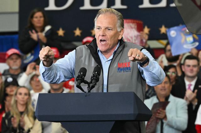 Republican candidate for US Senate Mike Rodgers speaks at a midterm campaign rally at CHI Aviation in Howell, Michigan on October 27, 2026. US Vice President JD Vance is due speak at the rally in support of Rodgers who is competing against Democratic candidate Abdul El-Sayed for the Michigan senate seat. (Photo by SAUL LOEB / POOL / AFP)