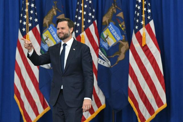 US Vice President JD Vance gestures to the crowd before speaking at a midterm campaign rally at CHI Aviation in Howell, Michigan on October 27, 2026. Vance is speaking in support of Rodgers who is running against Democratic candidate Abdul El-Sayed for the Michigan senate seat. (Photo by SAUL LOEB / POOL / AFP)
