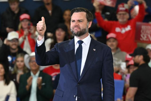 US Vice President JD Vance gives a thumbs up as he speaks at a midterm campaign rally at CHI Aviation in Howell, Michigan on October 27, 2026. Vance is speaking in support of Republican candidate for US Senate Mike Rodgers who is competing against Democratic candidate Abdul El-Sayed for the Michigan senate seat. (Photo by SAUL LOEB / POOL / AFP)