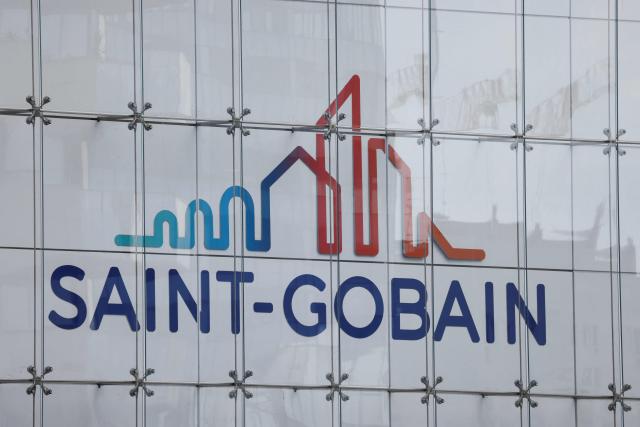 (FILES) Picture taken on September 14 2023, shows the Saint-Gobain headquarter building and logo in La Defense area, near Paris. Saint-Gobain announced on October 27, 2026 a 1.8% year-on-year increase in its revenue for the third quarter of 2026 and confirmed its goal of achieving an EBITDA margin, a profitability indicator, of more than 15% in 2026. (Photo by Ludovic MARIN / AFP)