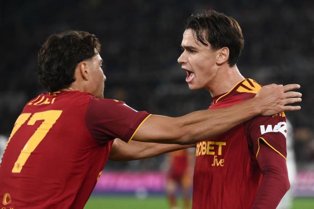 AS Roma's Italian midfielder #61 Niccolò Pisilli (R) celebrates with AS Roma's Italian defender #77 Emanuele Lulli (L) after scoring Roma's second goal during the Italian Serie A football match between AS Roma and Cagliari at the Olympic Stadium in Rome on October 27, 2026. (Photo by Isabella BONOTTO / AFP)