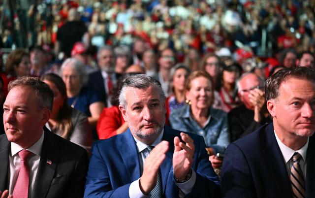 EPA Administrator Lee Zeldin (L), US senator from Texas Ted Cruz (C) and US representative Michael Cloud (R) listen to US President Donald Trump speak at a midterm campaign rally at Port of Corpus Christi in Corpus Christi, Texas on October 27, 2026. (Photo by Kent NISHIMURA / AFP)