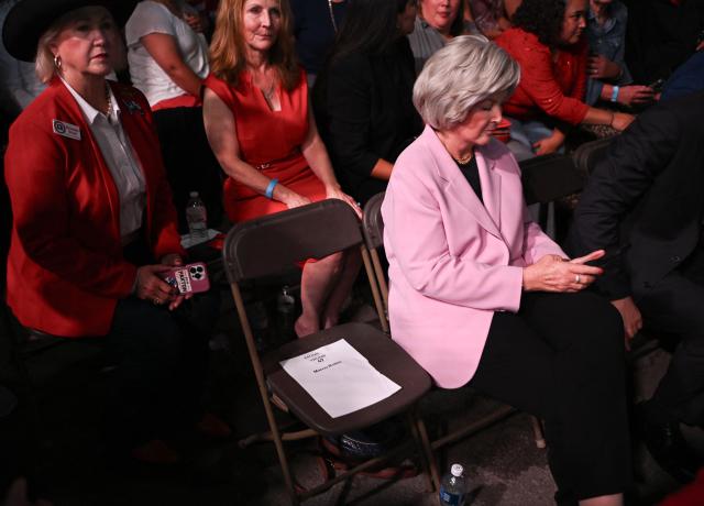 White House Chief of Staff Susie Wiles sits beside an empty chair reserved for US Secretary of State Marco Rubio as she listens to US President Donald Trump speak at a midterm campaign rally at the Port of Corpus Christi in Corpus Christi, Texas, on October 27, 2026. (Photo by Kent NISHIMURA / AFP)