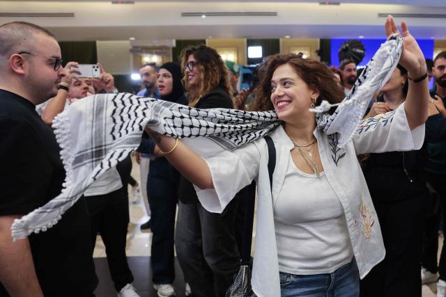 Supporters of Israel's Arab-led Joint List political alliance cheer at the alliance's campaign headquarters in the northern Israeli city of Nazareth  on October 27, 2026, as the first exit polls are announced on television during Israel's legislative election. Israeli voters on October 27 gave a narrow edge to opposition parties over Prime Minister Benjamin Netanyahu, initial projections showed, after decades-high turnout in the country's first election since the trauma of the October 7, 2023 attacks. (Photo by AHMAD GHARABLI / AFP)