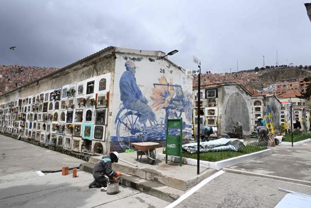 Workers carry out maintenance work at the General Cemetery in La Paz on October 27, 2026, ahead of All Saints' Day celebrations. (Photo by Aizar RALDES / AFP)