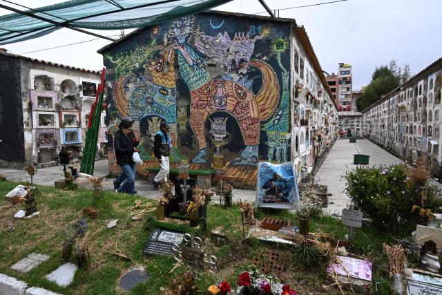 People visit the General Cemetery while maintenance work is carried out ahead of All Saints' Day celebrations in La Paz on October 27, 2026. (Photo by Aizar RALDES / AFP)