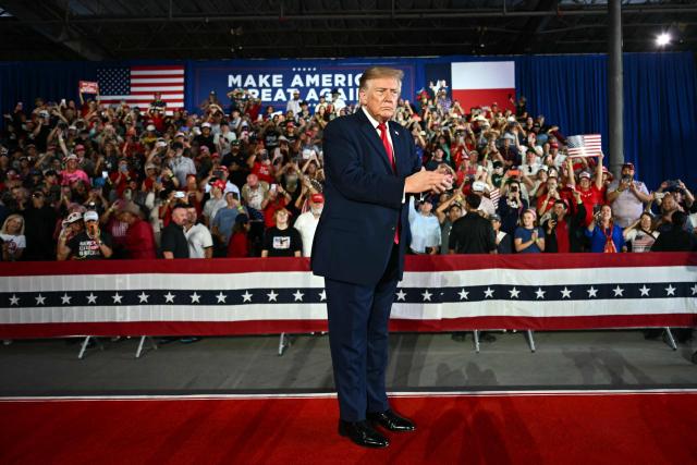 US President Donald Trump applauds after speaking at a midterm campaign rally at the Port of Corpus Christi in Corpus Christi, Texas on October 27, 2026. (Photo by Kent NISHIMURA / AFP)