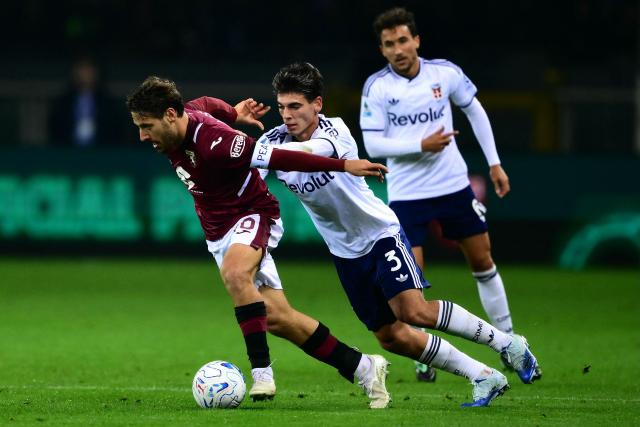 Torino’s Croatian midfielder #10 Nikola Vlasic fights for the ball with Como’s Spanish defender #3 Alex Valle during the Italian Serie A football match between Torino FC and Como 1907 at the Olympic Stadium Grande Torino in Turin, northern Italy on October 27, 2026. (Photo by Marco Bertorello / AFP)