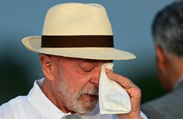 Brazil's President Luiz Inacio Lula da Silva cries during his birthday celebrations at the Alvorada Palace, the official presidential residence, in Brasilia on October 27, 2026. Lula da Silva turned 81 on October 27, 2026, promised to work "24 hours a day" following his historic re-election for a fourth term. (Photo by Pablo PORCIUNCULA / AFP)