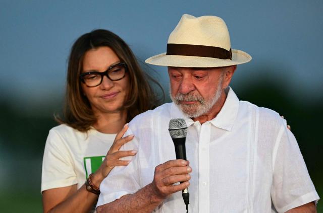 Brazil's President Luiz Inacio Lula da Silva is comforted by his wife Janja during his birthday celebrations at the Alvorada Palace, the official presidential residence, in Brasilia on October 27, 2026. Lula da Silva turned 81 on October 27, 2026, promised to work "24 hours a day" following his historic re-election for a fourth term. (Photo by Pablo PORCIUNCULA / AFP)
