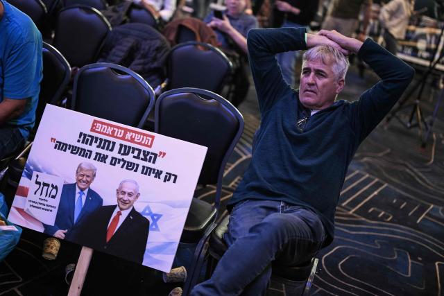 A supporter of the Likud party leader and Prime Minister Benjamin Netanyahu waits at the election night rally in Jerusalem on October early on 28, 2026. Israeli voters on October 27 gave a narrow edge to opposition parties over Prime Minister Benjamin Netanyahu, initial projections showed, after decades-high turnout in the country's first election since the trauma of the October 7, 2023 attacks. (Photo by Jewel SAMAD / AFP)