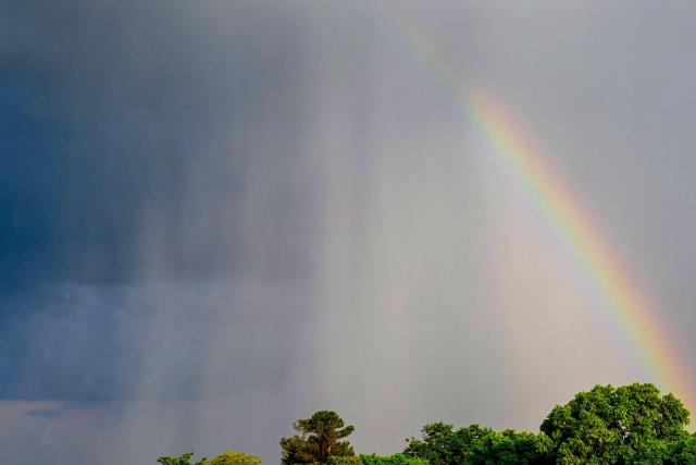 Partial view of a rainbow under heavy clouds ahead of celebrations marking President Luiz Inacio Lula da Silva's 81st birthday in Brasilia on October 27, 2026. Lula da Silva turned 81 on October 27, 2026, promised to work "24 hours a day" following his historic re-election for a fourth term. (Photo by Pablo PORCIUNCULA / AFP)