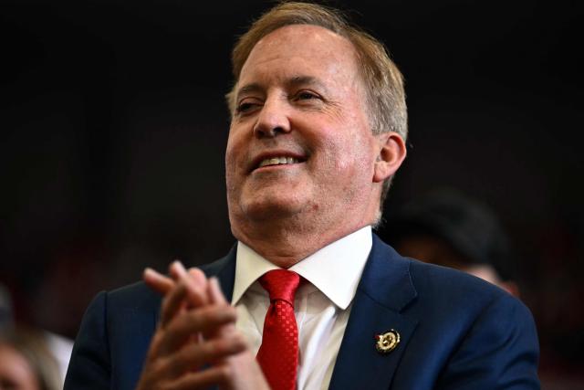 Texas Attorney General and Republican candidate for the US Senate Ken Paxton applauds during a campaign rally with US President Donald Trump at Lubbock Memorial Civic Center in Lubbock, Texas on October 27, 2026. (Photo by Kent NISHIMURA / AFP)