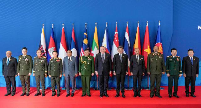 (L-R) Brunei's Defence Minister Halbi Mohammad Yussof, Cambodia’s Defence State Secretary Rath Dararoth, Indonesia’s Defence Vice Minister Richard Tampubolon, Laos' Defence Minister Khamlieng Outhakaisone, Malaysia's Defence Minister Mohamed Khaled Nordin, Myanmar’s Defence Attache to the Philippine Tun Tun San, Philippines' Defence Secretary Gilberto Teodoro, Singapore's Defence Minister Chan Chun Sing, Thailand’s Deputy Permanent Secretary for Defence Amarit Boonsuya, East Timor’s Chief of Defence Force Falur Rate Laek, Vietnam's Defence Minister Phan Van Giang and ASEAN Secretary-General Dr. Kao Kim Hourn pose for a family photo at the opening ceremony of the 20th Association of Southeast Asian Nations (ASEAN) Defence Ministers' Meeting in Cebu, central Philippines on October 28, 2026. (Photo by Aaron Favila / POOL / AFP)