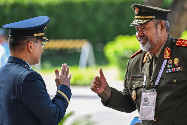 East Timor’s Chief of Defence Force Falur Rate Laek (R) arrives to attend the opening ceremony of the 20th Association of Southeast Asian Nations (ASEAN) Defence Ministers' Meeting in Cebu, central Philippines on October 28, 2026. (Photo by Jam STA ROSA / POOL / AFP)