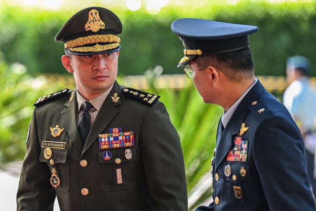 Cambodia’s Defence State Secretary Rath Dararoth (L) arrives to attend the opening ceremony of the 20th Association of Southeast Asian Nations (ASEAN) Defence Ministers' Meeting in Cebu, central Philippines on October 28, 2026. (Photo by Jam STA ROSA / POOL / AFP)