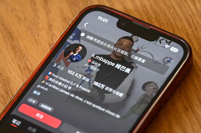 This photo illustration shows French football star Kylian Mbappe's Chinese social media Rednote account displaying the message: "This account has been muted for violating community guidelines”, in Shanghai on October 28, 2026. Kylian Mbappe apologised on October 27, after the Real Madrid star was dropped by major Chinese brands for apparently joking about Mao Zedong in a video that has gone viral. (Photo by Jade GAO / AFP)