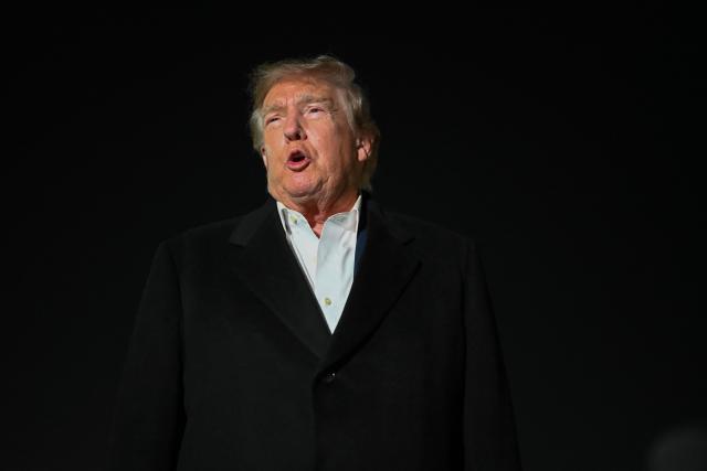 US President Donald Trump speaks to members of the media after disembarking from Air Force One at Joint Base Andrews, Maryland during the early hours of October 28, 2026. President Trump is returning from Texas where he attended midterm campaign rallies. (Photo by Kent NISHIMURA / AFP)