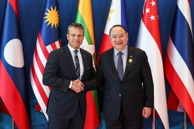 US Defence Secretary Pete Hegseth (L) is welcomed by Philippines' Defence Secretary Gilberto Teodoro (R) during the Association of Southeast Asian Nations (ASEAN) Defence Ministers' Informal Meeting with the United States in Cebu, central Philippines, on October 28, 2026. (Photo by ELOISA LOPEZ / POOL / AFP)