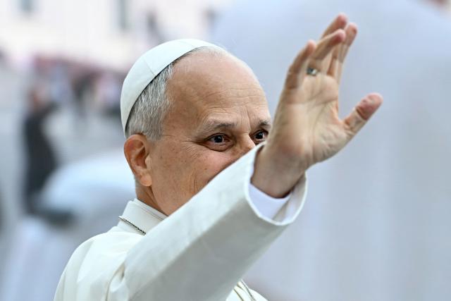 Pope Leo XIV waves to pilgrims gathered in St. Peter's Square as he arrives to lead the weekly general audience at The Vatican on October 28, 2026. (Photo by Filippo MONTEFORTE / AFP)
