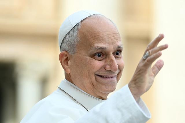 Pope Leo XIV waves to pilgrims gathered in St. Peter's Square as he arrives to lead the weekly general audience at The Vatican on October 28, 2026. (Photo by Filippo MONTEFORTE / AFP)