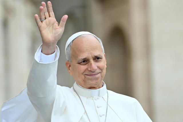 Pope Leo XIV waves to pilgrims gathered in St. Peter's Square as he arrives to lead the weekly general audience at The Vatican on October 28, 2026. (Photo by Filippo MONTEFORTE / AFP)
