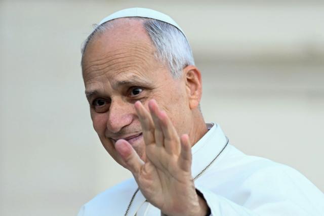 Pope Leo XIV waves to pilgrims gathered in St. Peter's Square as he arrives to lead the weekly general audience at The Vatican on October 28, 2026. (Photo by Filippo MONTEFORTE / AFP)