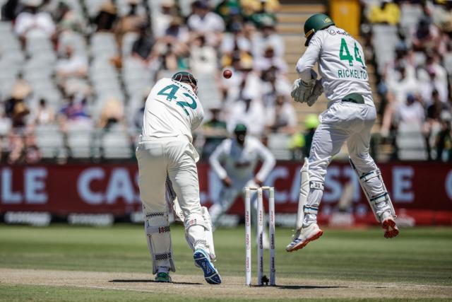 South Africa's Ryan Rickelton jumps to field a ball played by Australia's Cameron Green on day two of the third Test match between South Africa and Australia at Newlands stadium in Cape Town on October 28, 2026. (Photo by Marco Longari / AFP)