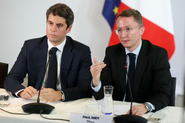 Ensemble Pour la Republique's MP Paul Midy (R) speaks next to Centre-right party Renaissance candidate in France's 2027 presidential election Gabriel Attal during a press conference to present Gabriel Attal's proposed economic measures to boost growth at Renaissance's headquarters in Paris on October 28, 2026. (Photo by Thomas SAMSON / AFP)