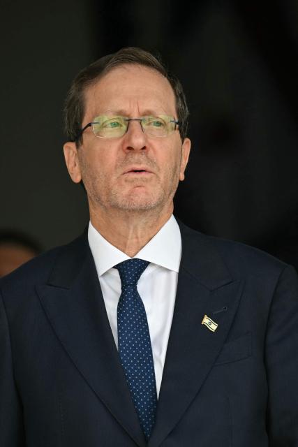 (FILES) Israel's President Isaac Herzog looks on during a meeting with his Panamanian counterpart at the Las Garzas palace in Panama City on May 6, 2026. Israel's President Isaac Herzog is known for his unassuming and mild manner, but all eyes will soon be on him as he decides who to task with forming the next coalition government. The decision is a weighty one given that partial results show neither the camp of the Prime Minister Benjamin Netanyahu nor that of his rival Gadi Eisenkot securing a majority in parliament. (Photo by MARTIN BERNETTI / AFP)